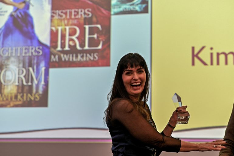 Kim Wilkins receives an award